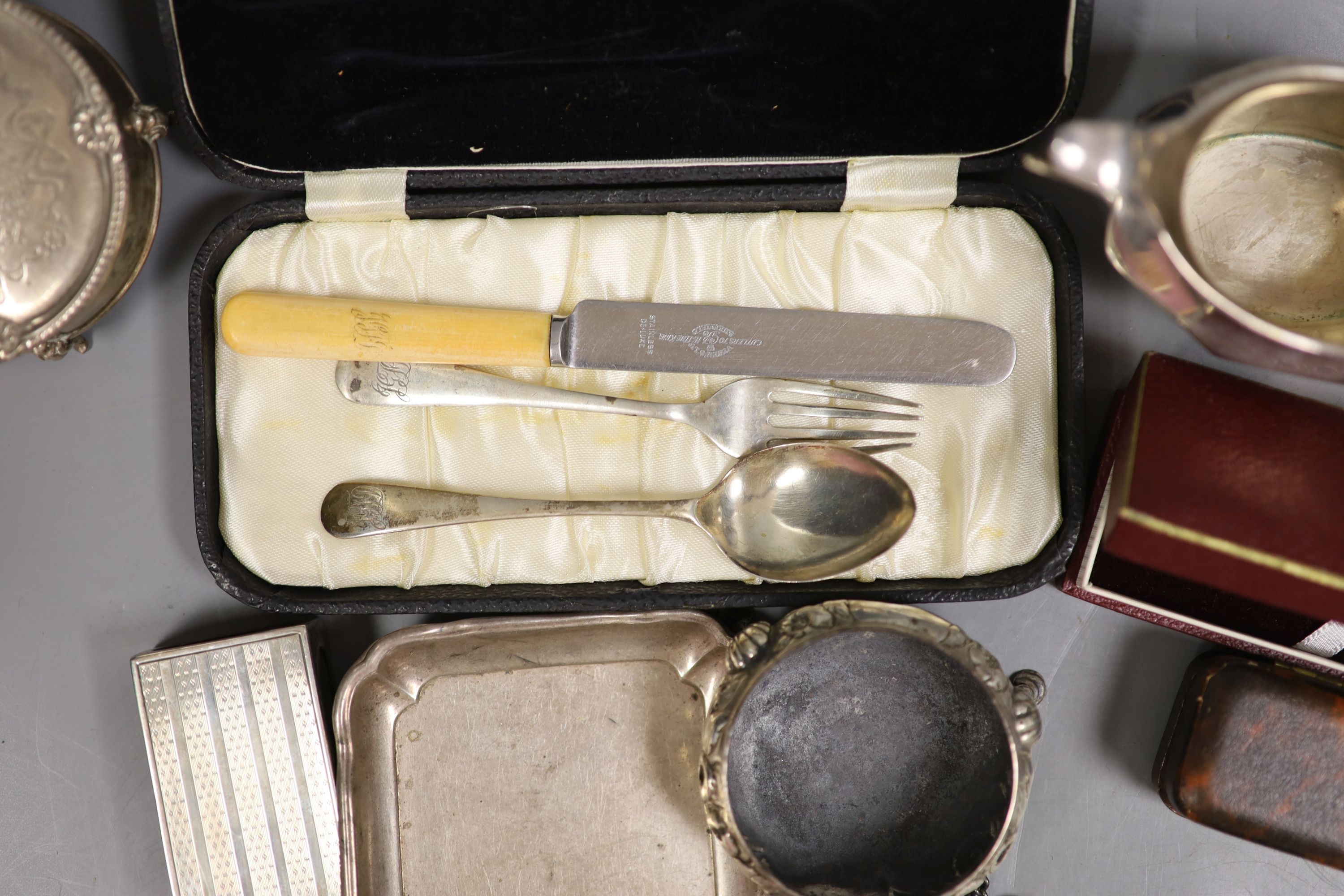 Sundry small silver including a silver trinket box, Victorian salt, two silver cream jugs, three silver dishes, 19th century mother of pearl snuff box, 6cm, pocket watch, photograph frames, etc.